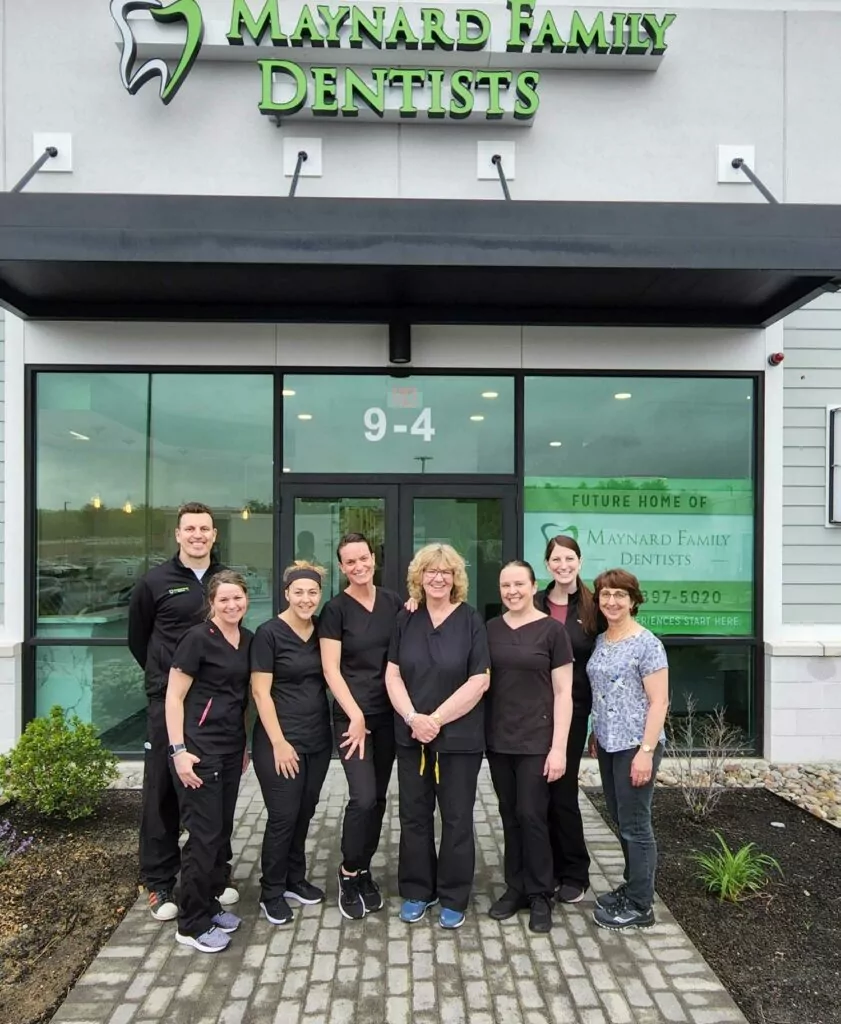 employees of Maynard Family Dentists in front of the building